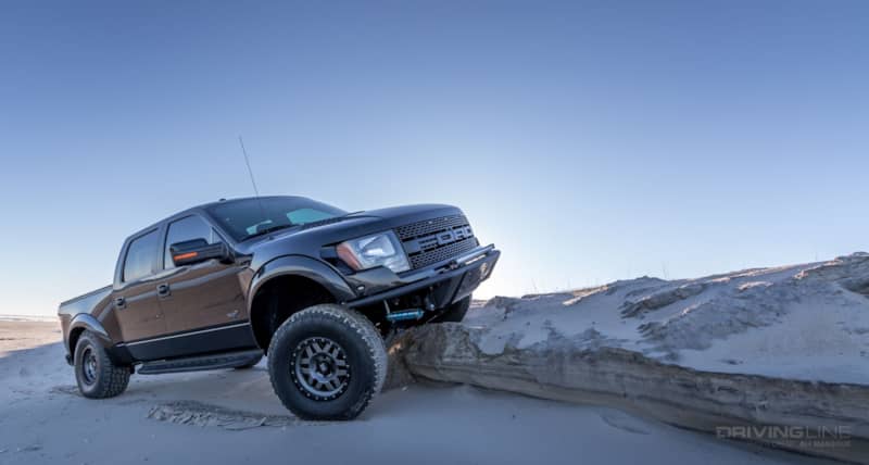 Gen 1 Ford Raptor Black flexing suspension on beach
