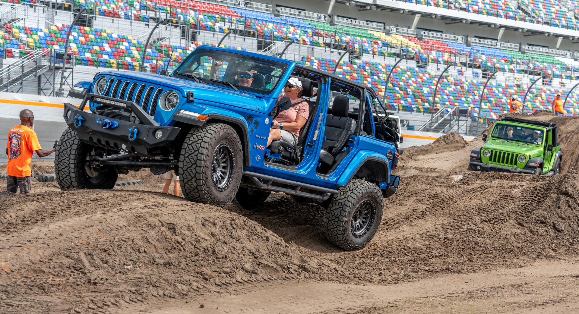 Blue Jeep Wrangler on Nitto recon Grapplers on Jeep Beach obstacle course