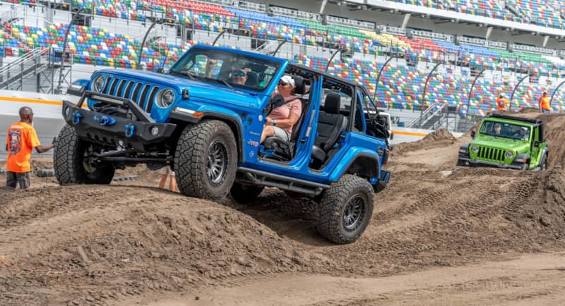 Blue Jeep Wrangler on Nitto recon Grapplers on Jeep Beach obstacle course