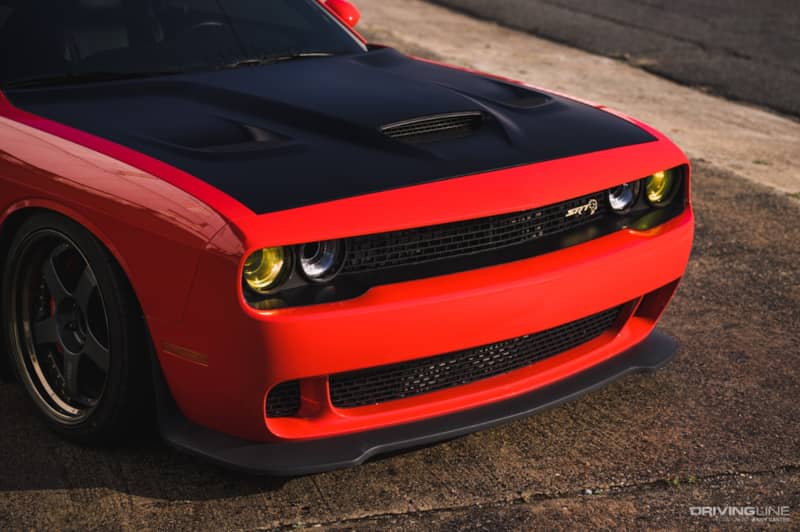 Dodge Challenger in red on Nitto tires front clip view