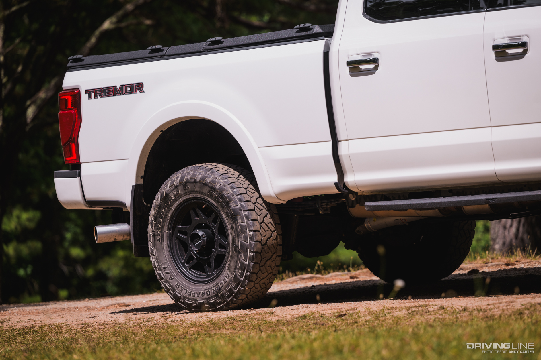 rear wheel and bed of a F250 Platinum Tremor with Nitto Recon Grappler Tires