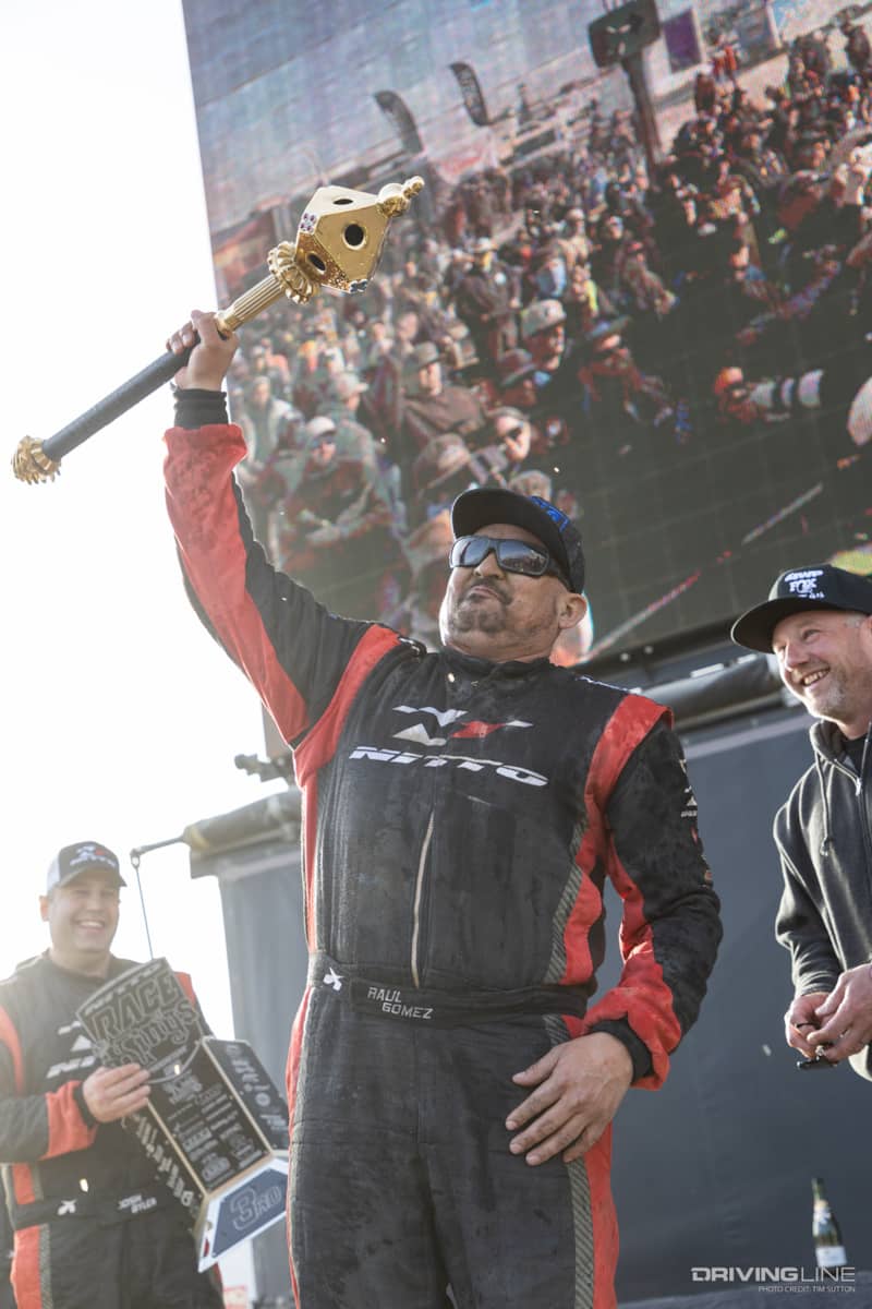 Raul Gomez holding the King of the Hammer Scepter on the podium at the 2023 Nitto Race of Kings