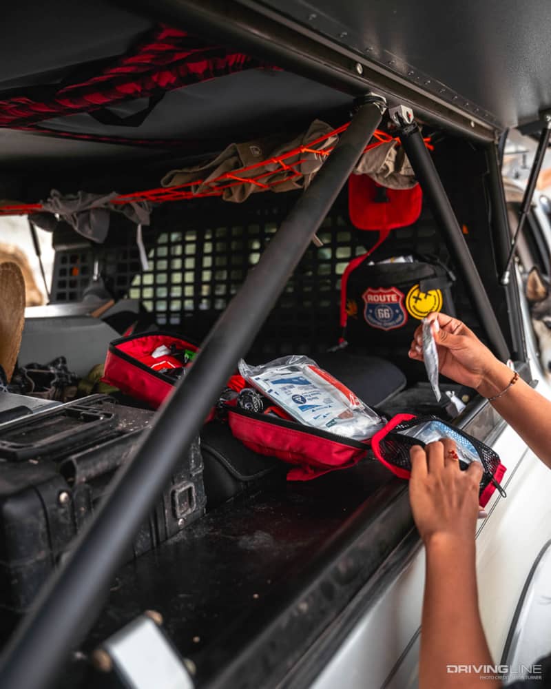 First aid kit in the bed of Tacoma