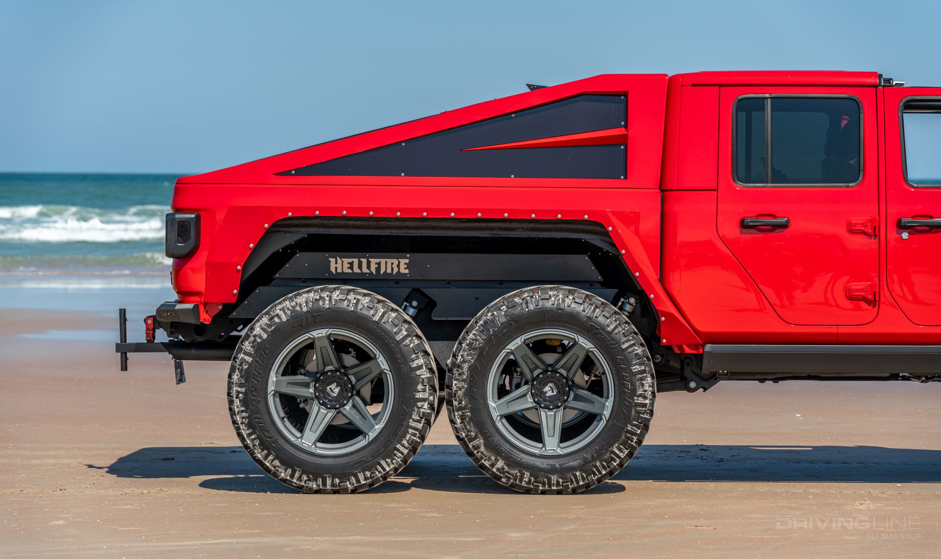 Jeep Gladiator 6x6 on 40s side view red Jeep Beach Daytona Beach