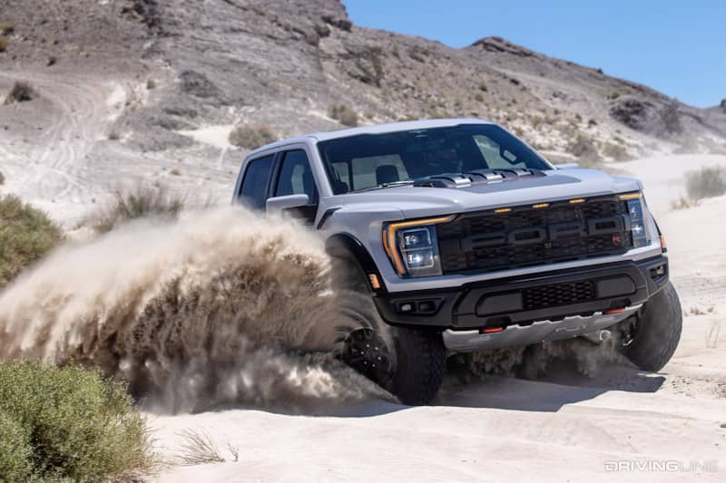 Ford Raptor R splashing through sand