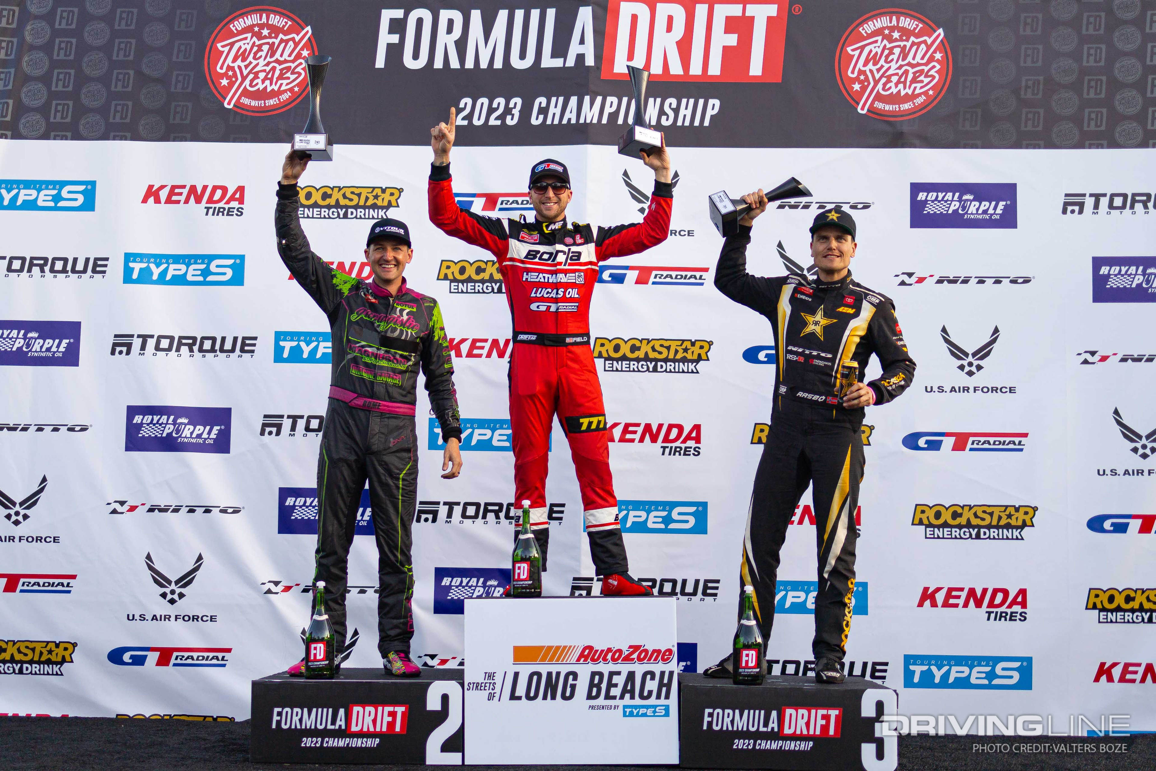 Top three drivers on Podium from 2023 Formula Drift Long Beach, Matt Field, Rome Charpentier, and Fedric Aasbo