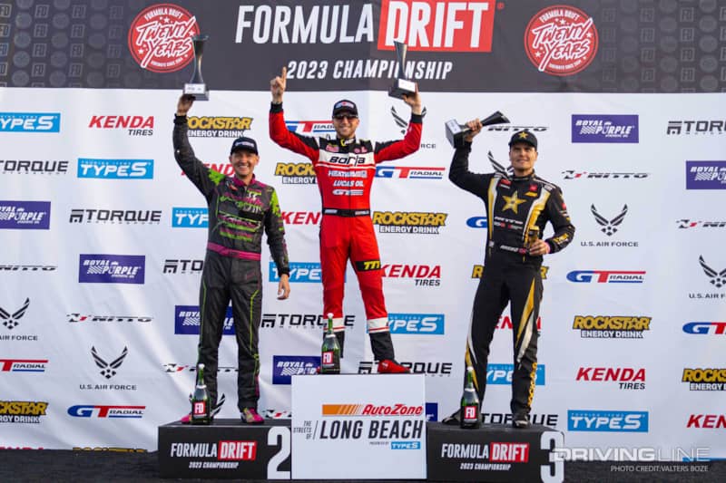 Top three drivers on Podium from 2023 Formula Drift Long Beach, Matt Field, Rome Charpentier, and Fedric Aasbo