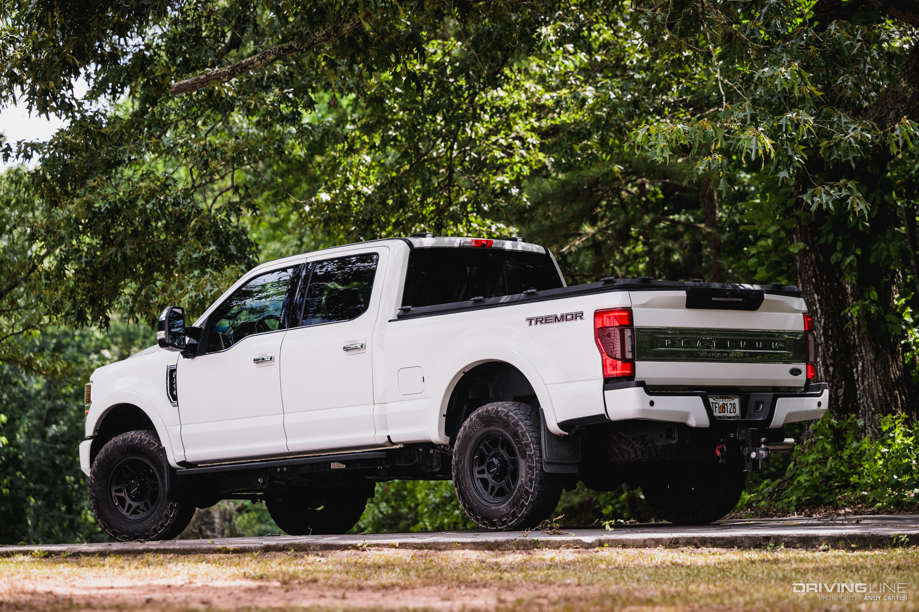 rear 3/4 driver side of F250 Platinum Tremor with Nitto Recon Grappler Tires