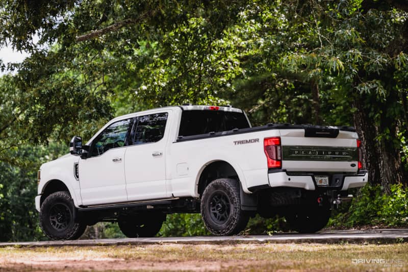 rear 3/4 driver side of F250 Platinum Tremor with Nitto Recon Grappler Tires