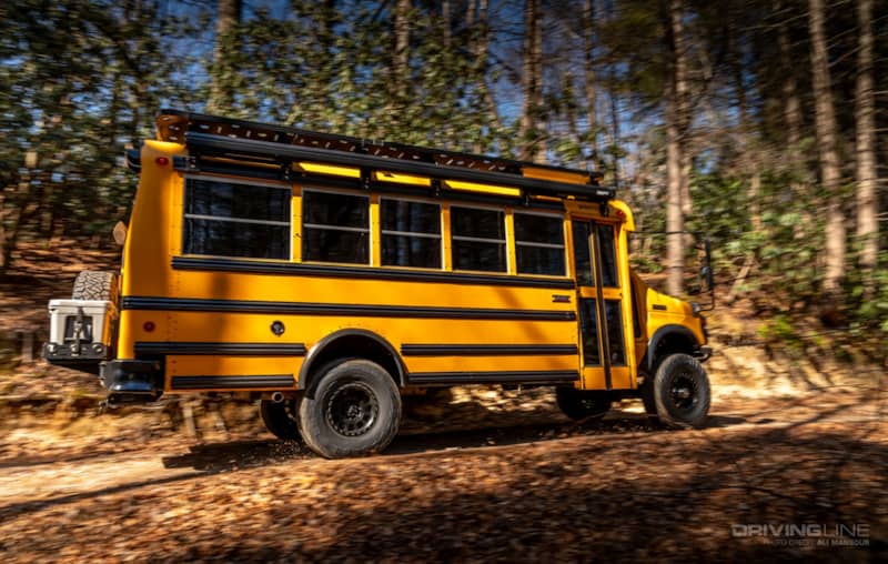 2013 Ford E-450 4x4 School Bus on 37's Nitto Ridge Grapplers Ujoint Offroad side view driving