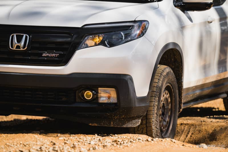 Honda Ridgeline in off-road rut