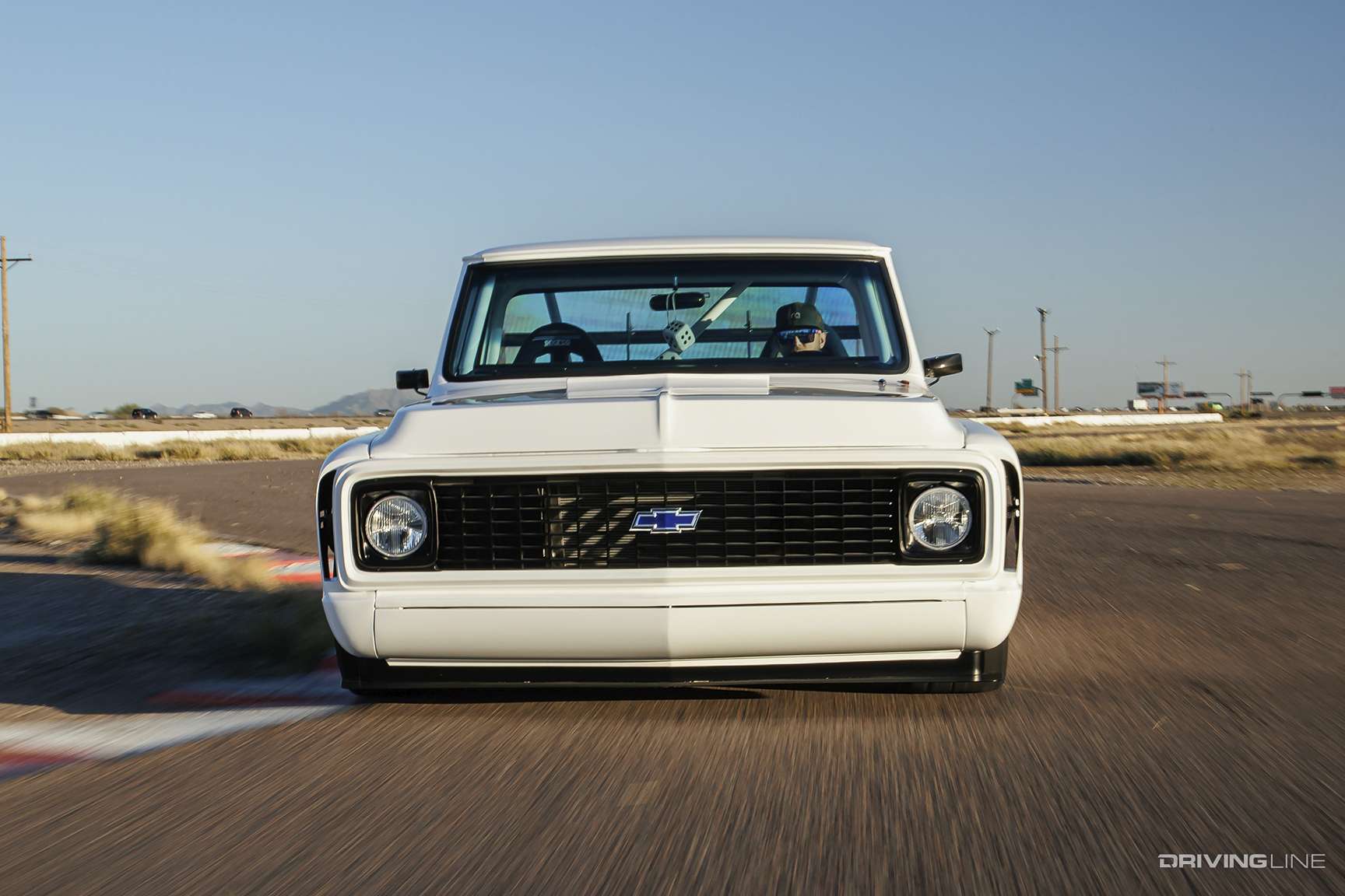 Front of Cameron Bishop's ’72 Chevy C10 driving on a track