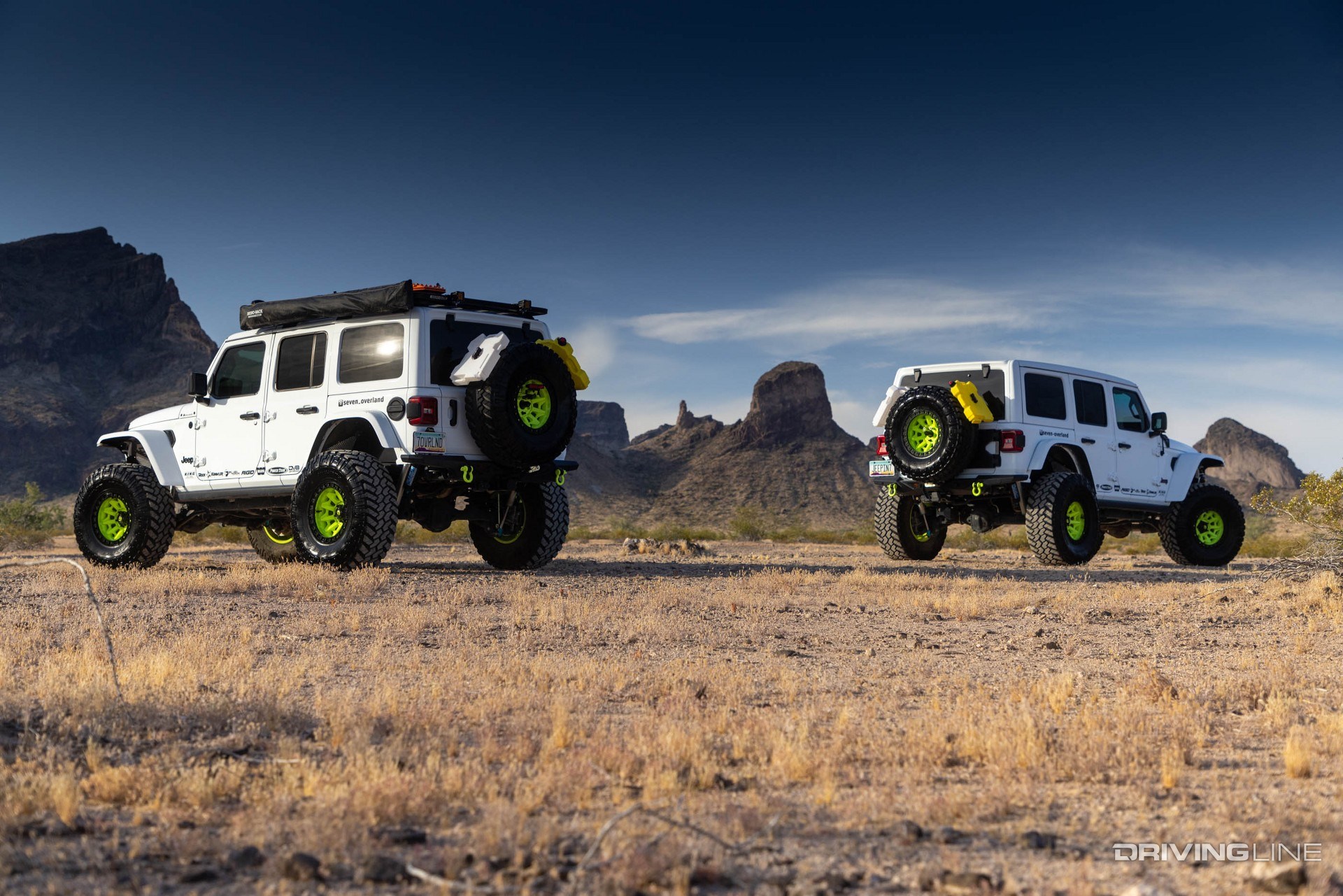 Jeep Wrangler Overlanding white in desert rear view two shot