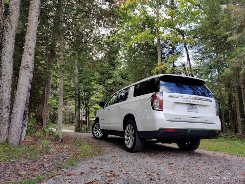 Chevrolet Suburban rear view in forest