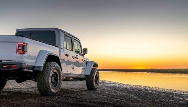 Jeep Gladiator Rubicon white sunset beach rear view on 35 Nitto Ridge Grapplers