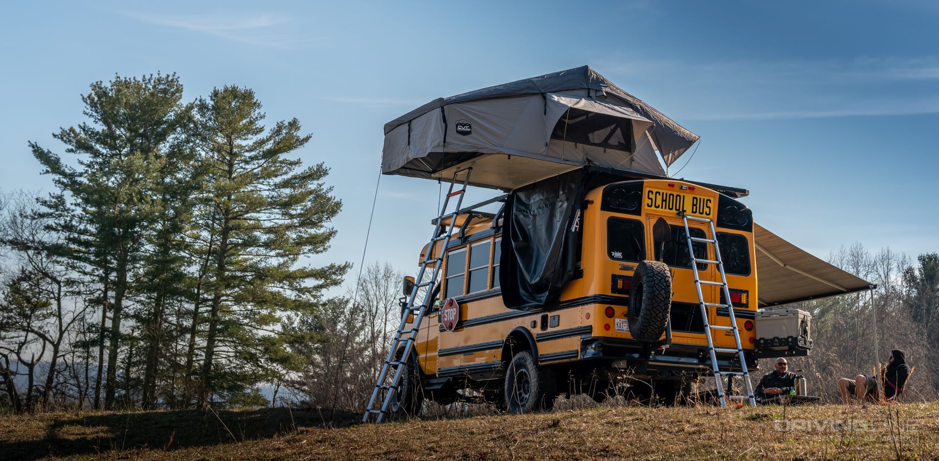 2013 Ford E-450 4x4 School Bus on 37's Nitto Ridge Grapplers Ujoint Offroad CVT Tent open