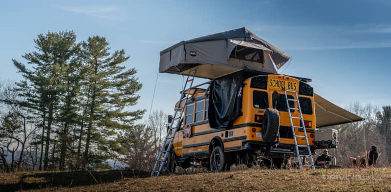 2013 Ford E-450 4x4 School Bus on 37's Nitto Ridge Grapplers Ujoint Offroad CVT Tent open