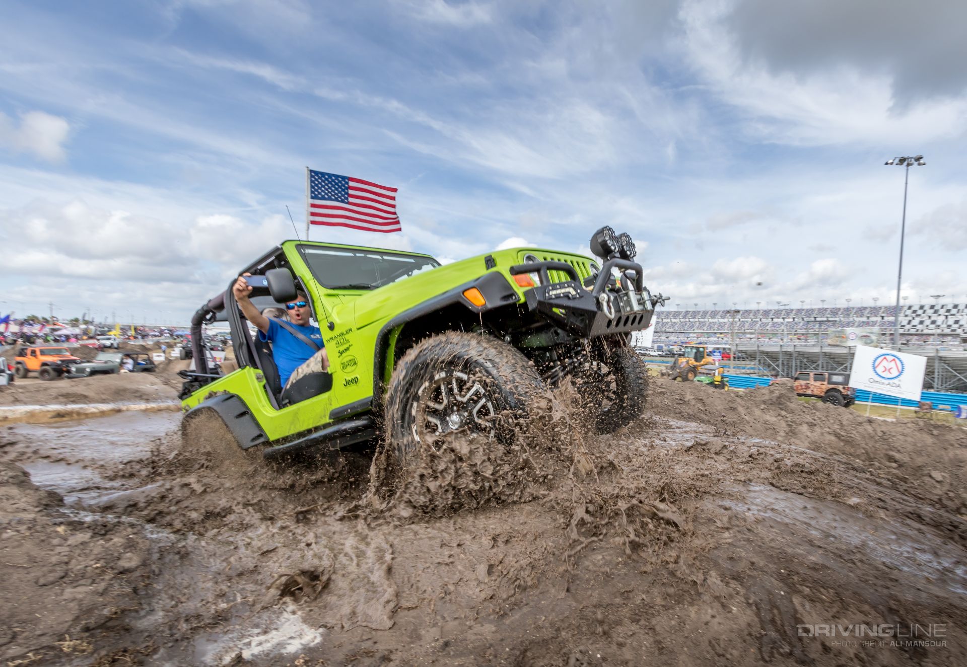 Green Jeep Wrangler TJ mud off-road course Jeep Beach Daytona Speedway