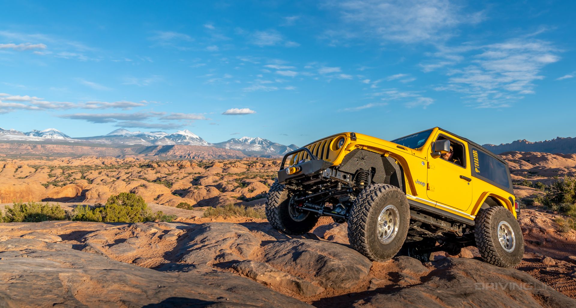 Yellow Jeep Wrangler two door Hells Revenge Moab Utah